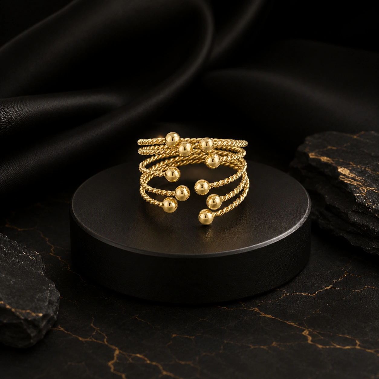 Bague torsadée à 5 rangs ornée de 10 petites boules